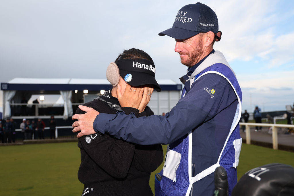 Lydia Ko of New Zealand celebrates victory with her caddie, Paul Cormack during Day Four of the AIG Women's Open